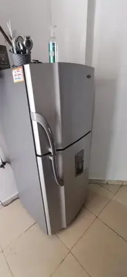 a refrigerator with its door open in a kitchen at Apartamento vacacional en Medellín central privado y tranquilo in Medellín