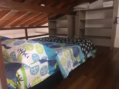 a small bed in a room with a bunk bed at Apartamento Lof, Dúplex, iluminado, bueno , céntrico y bien ubicado en Laureles estadio in Medellín