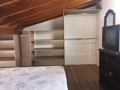 a bedroom with a bed and a tv at Apartamento Lof, Dúplex, iluminado, bueno , céntrico y bien ubicado en Laureles estadio in Medellín