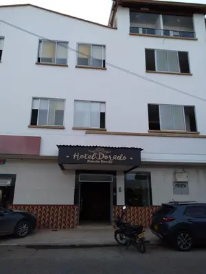 a motorcycle parked in front of a building at HOTEL DORADO PUERTO BERRIO in Puerto Berrío