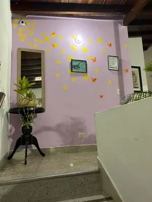 a room with a wall with stars and a mirror at Hostel Urban City Medellin in Medellín