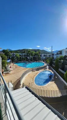 a view of a swimming pool at a resort at Apartasol Ciudadela Santafe - Santa Fe de Antioquia in Santa Fe de Antioquia