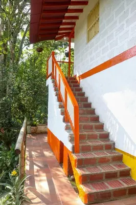 a set of stairs leading up to a house at Finca Los Abuelos - La Planta in Concepción