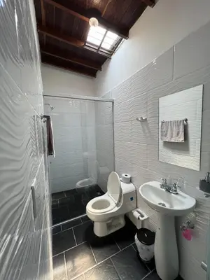 a bathroom with a toilet and a sink at APARTAMENTO AMOBLADO SECTOR LAURELES-ESTADIO hasta 8 personas - Londres in Medellín