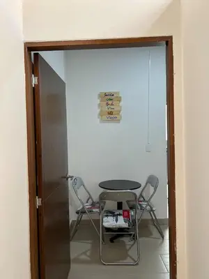 a table and chairs in a room with a glass door at APARTAMENTO AMOBLADO SECTOR LAURELES-ESTADIO hasta 8 personas - Londres in Medellín