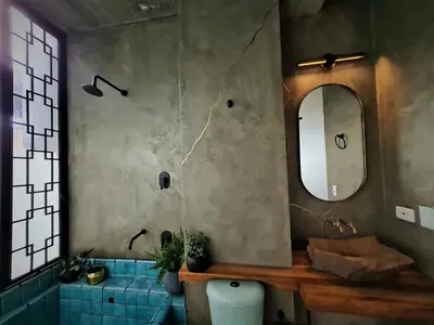 a bathroom with a sink and a mirror and a toilet at Nido Sky in Medellín