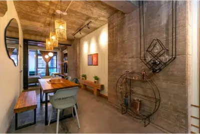 a living room with a table and a dining room at Nido Sky in Medellín