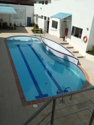a large swimming pool with a boat on top of it at Hotel Kariary in Puerto Boyacá