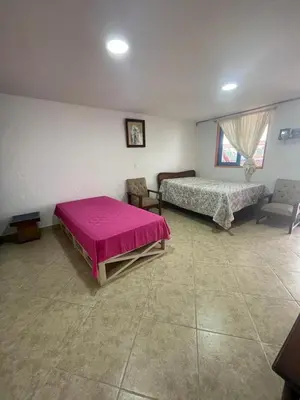 a large room with two beds and a couch at Villa Chela, Hermosa casa de descanso, Venecia Antioquia in Venecia