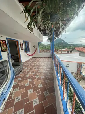 a balcony of a house with a tile floor at Villa Chela, Hermosa casa de descanso, Venecia Antioquia in Venecia