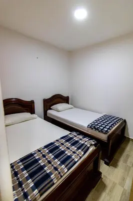 a room with two beds in a room at Vista montaña Guatape by Hope in Guatapé
