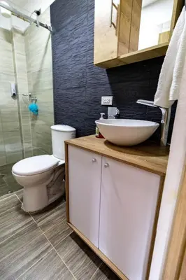 a bathroom with a sink and a toilet and a shower at Vista montaña Guatape by Hope in Guatapé