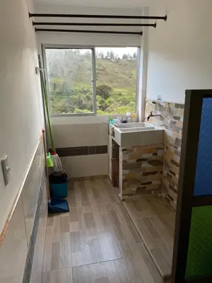 a bathroom with a sink and a window at Vista montaña Guatape by Hope in Guatapé