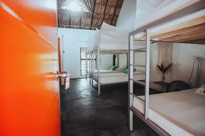 a room with two bunk beds and a hallway at Makenke Hostel By Los Colores Ecoparque in Doradal
