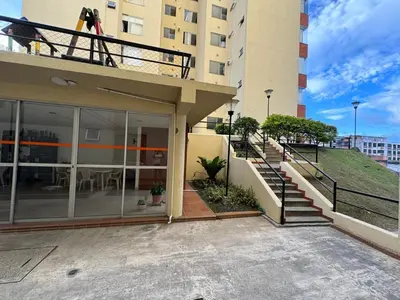 a balcony of a building with stairs and a table at MARGARETH in Manizales
