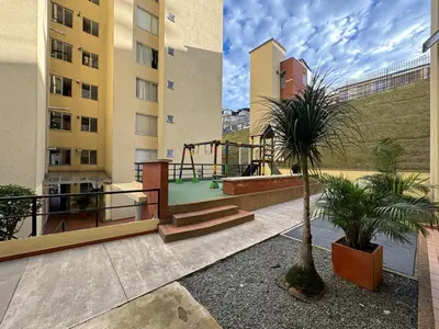 a courtyard with a playground in a building at MARGARETH in Manizales