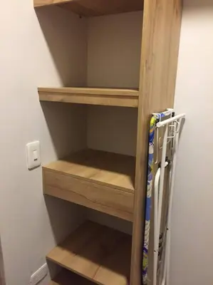 a closet with wooden shelves and some skis in it at Hermosa vista! Mejor ubicación! in Medellín