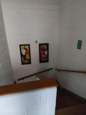 a room with two framed pictures on the wall at Cabaña con aire acondicionado San Jeronimo in San Jerónimo
