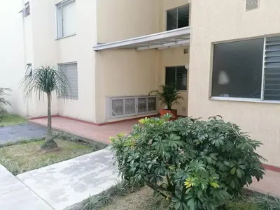 a house with a palm tree in front of it at GIBRALTAR in Manizales