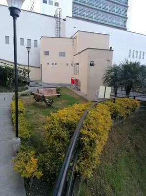 a park with a bench and a street light at KOROLOVA in Manizales