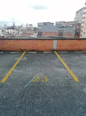 a parking lot with a brick wall at KOROLOVA in Manizales