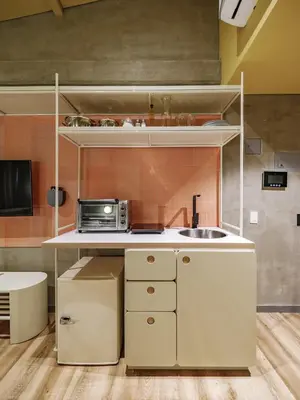 a kitchen with a sink and a microwave at The Somos Flats Provenza in Medellín