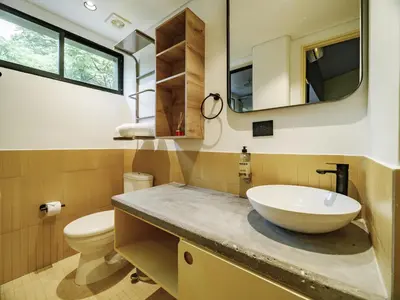 a bathroom with a sink and a toilet at The Somos Flats Provenza in Medellín