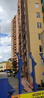 a blue sculpture in front of a tall building at Hermoso Apartamento Ubicado en Zona Céntrica de Medellín in Medellín