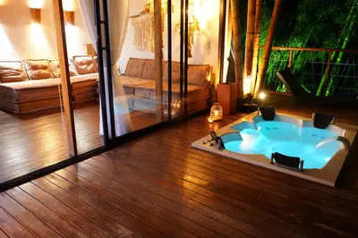 a living room with a tub in the middle of the floor at Ibuku Hotel Guatapé - Chalets in Guatapé