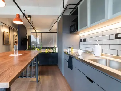 a kitchen with a wooden counter and a sink at Lauret Lofts by Wynwood House in Medellín