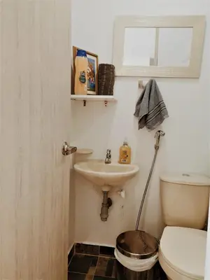 a bathroom with a sink and a toilet at Apartment cerca centro histórico Sta Fe Antioquia in Santa Fe de Antioquia