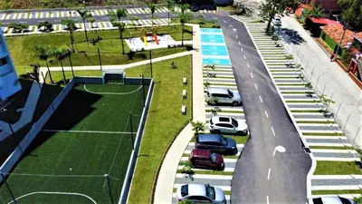 an aerial view of a parking lot with a tennis court at Apartment cerca centro histórico Sta Fe Antioquia in Santa Fe de Antioquia