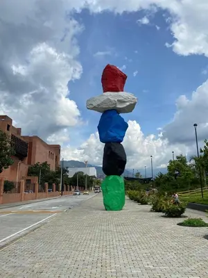 a statue of a mushroom on the side of a street at Conquistadores Romantic, Medellín in Medellín