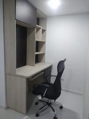 a desk and a chair in a room at Conquistadores Romantic, Medellín in Medellín