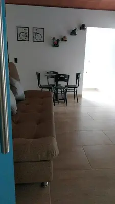 a living room with a couch and a table at Aldea Inmueble in Doradal