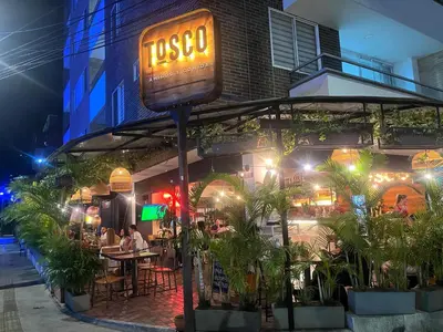 a sign in front of a restaurant at night at Hermoso y confort Apto en Medellín Cerca al Metro in Medellín