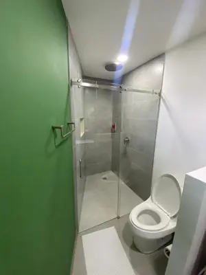 a bathroom with a shower and a toilet at Balcones de la pradera by Hope in Guatapé