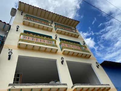 a tall building with balconies on the side of it at Balcones de la pradera by Hope in Guatapé