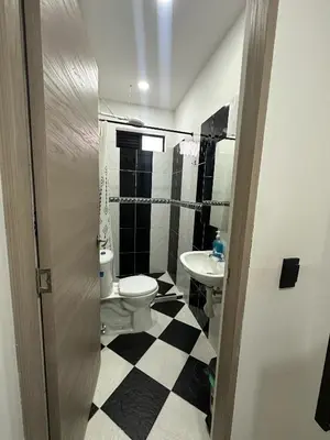 a bathroom with a toilet and a sink at HOTEL BLUE GUATAPE in Guatapé
