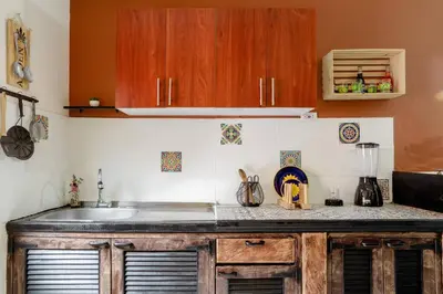 a kitchen with a sink and a counter top at Rústic-HOUSE Envigado in Envigado