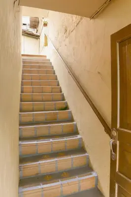 a staircase leading up to a building with a door at Rústic-HOUSE Envigado in Envigado