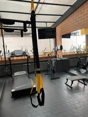 a view of a room with a gym with a swing at Hotel Torre Poblado in Medellín