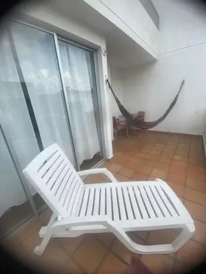 a white bench in a room with a hammock at CASA VACACIONAL CON PISCINAS EN SAN JERONIMO - CIUDADELA PREMIUm in Medellín
