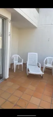 three white chairs sitting on a porch with a floor at CASA VACACIONAL CON PISCINAS EN SAN JERONIMO - CIUDADELA PREMIUm in Medellín