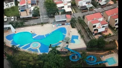 an overhead view of a swimming pool with a bird painted on it at CASA VACACIONAL CON PISCINAS EN SAN JERONIMO - CIUDADELA PREMIUm in Medellín