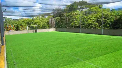 an artificial grass soccer field with a goal at CASA VACACIONAL CON PISCINAS EN SAN JERONIMO - CIUDADELA PREMIUm in Medellín