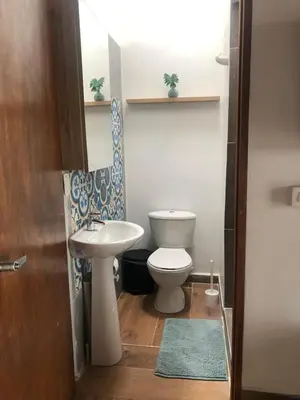 a bathroom with a toilet and a sink at Finca hotel la fortuna in San Pedro