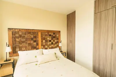 a bedroom with a bed with green apples on it at Hermoso y cómodo apartamento en El Poblado!!! in Medellín