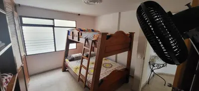 a small room with bunk beds and a window at 1023 Los Colores Estadio apartamento - Parqueadero - Zona Wifi - Coworking - Área exclusiva de la ciudad in Medellín
