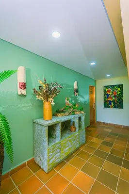 a room with a counter with plants on the wall at Hotel Bambu Guatape in Guatapé